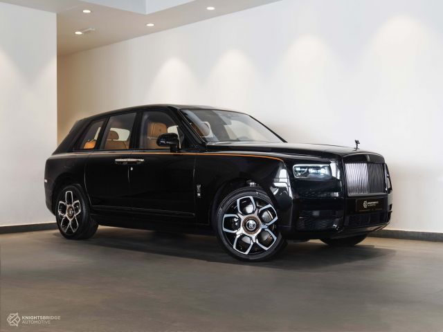 Perfect Condition 2021 Rolls-Royce Cullinan Black Badge Black exterior with Yellow interior at Knightsbridge Automotive