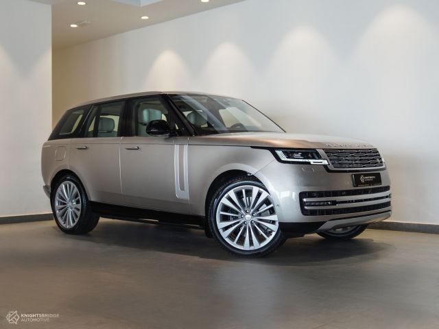 New 2022 Range Rover Vogue First Edition Gold exterior with White interior at Knightsbridge Automotive