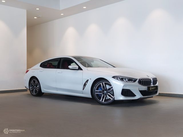 Perfect Condition 2022 BMW 840i Gran Coupe White exterior with Red and Black interior at Knightsbridge Automotive
