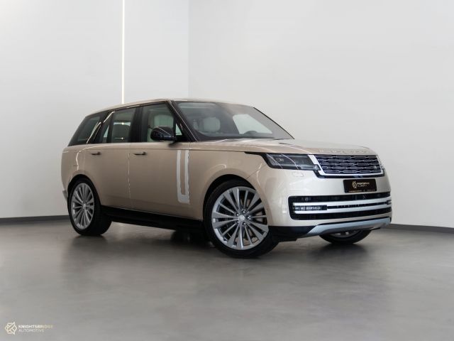 New 2022 Range Rover Vogue First Edition Gold exterior with White interior at Knightsbridge Automotive