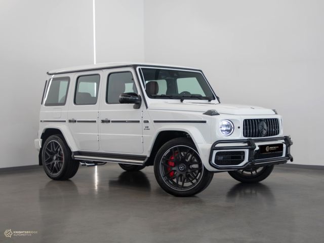 New 2023 Mercedes-Benz G63 AMG White exterior with Red and Black interior at Knightsbridge Automotive