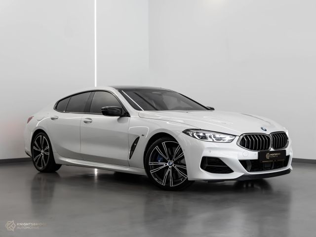 Used - Perfect Condition 2020 BMW M850i White exterior with Red and Black interior at Knightsbridge Automotive